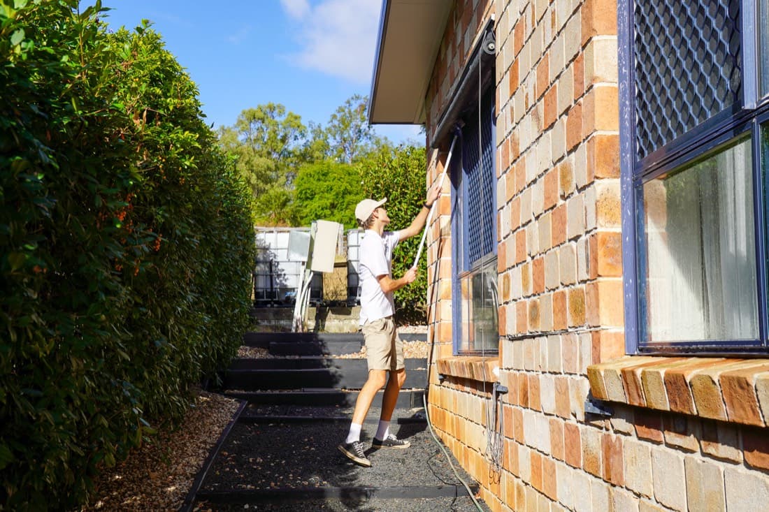 Pole work down the side path of a Gatton home